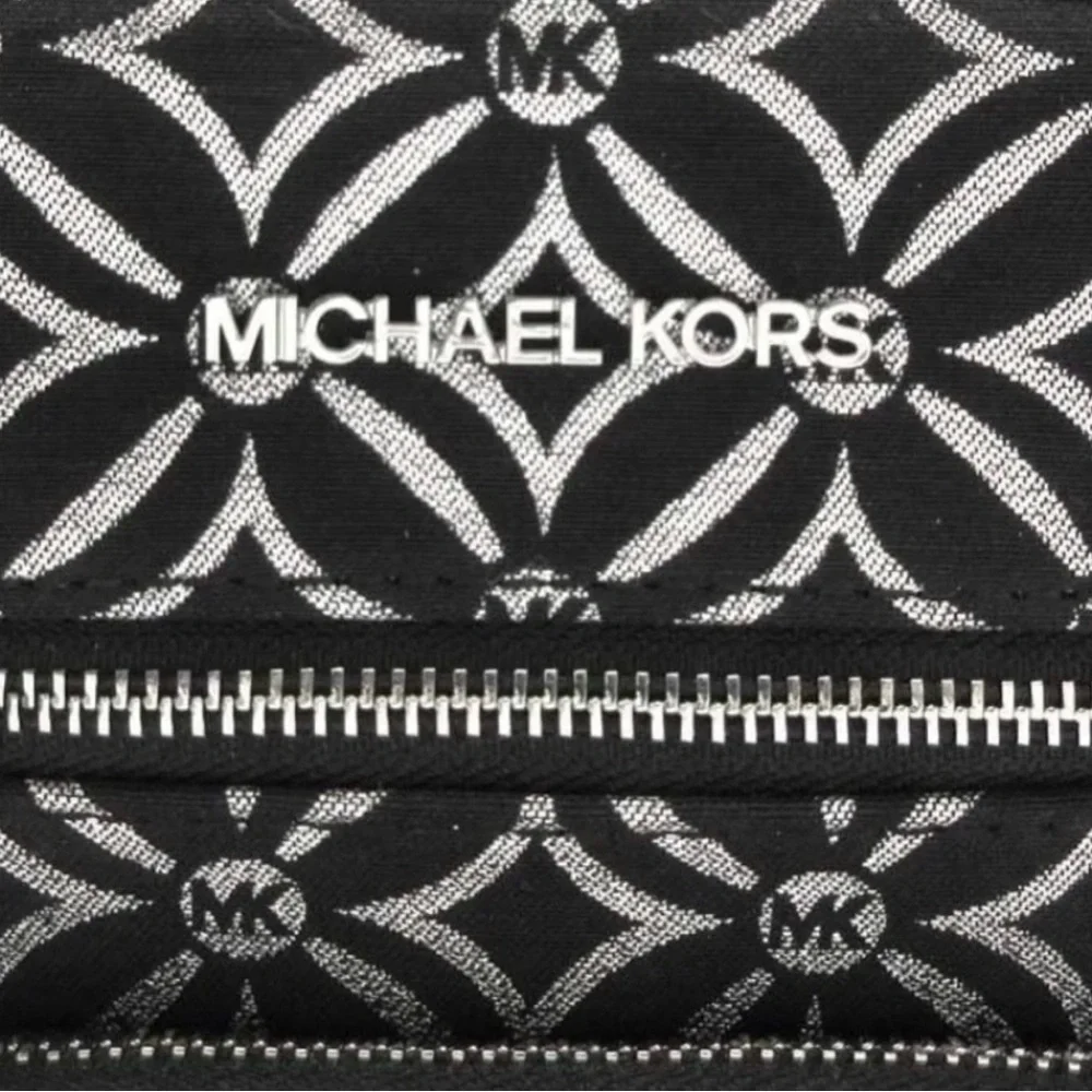 Michael Kors NWT Jet Set black and silver crossbody with guitar strap, NWT